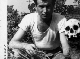 Sydney Fletchenfield with a skull in India, during WWII.  Photo from Dan McCarthy.