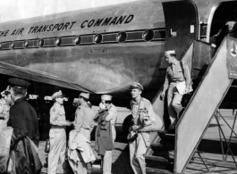 GIs depart a C-54 of the Air Transport Command (ATC) at Karachi during WWII. The 1306th Army Air Force Base Unit (306th AAFBU) provided services such as the stairs down from the plane.  The Photo from Al De Grasse.