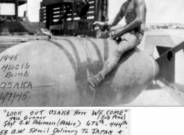 Tail gunner S/Sgt. J. W. Robinson (Robbie), 444th Bombardment Group  (originally of the 676th Bombardment Squadron), rides a 4000 lb destined for Japan in WWII, on June 7, 1945.