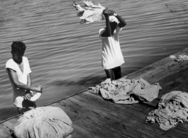 Laundry being done outside in Kanchrapara, India, 1944.  Photo by Syd Greenberg.