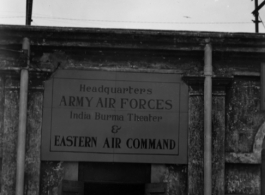 T/Sgt. George M. Zdanoff standing at HQ at Hastings Mills, India, during WWII.