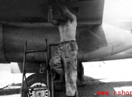 George Butsika working under wing of B-25. Yangkai, May 1944.  From the collection of Frank Bates.