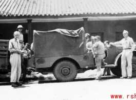 William Butler, Wayne Crusan, Trombley, Derby, Frenchy Beaudetter, Daggett. Outside base office buildings.  Probably at Yangkai.  From the collection of Frank Bates.