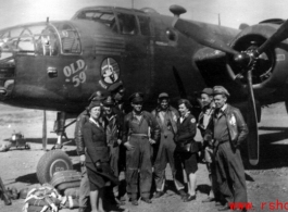 American service men and women pose before "Old 59," March 1944.  From the collection of Frank Bates.