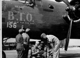 Chinese crewmen of the Chinese and American Replacement Training Unit get a last minute briefing from an American officer prior to take off on another mission. Karachi, India. Standing before the B-25 "B. T. O."  Image courtesy of Tony Strotman.