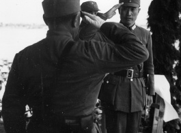 Chinese Lt. General Du Yuming, commander of Nationalist 5th Corps (第五集团军总司令兼昆明防守司令杜聿明) salutes Gen. Wei Lihuang (卫立煌) on stage during rally.