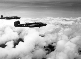 B-25 Mitchell bombers in flight in the CBI, in the area of southern China, Indochina, or Burma.