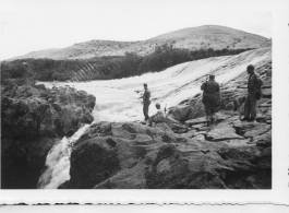 A dam and and falls about 8 miles southeast of the Luliang air base area in Yunnan province, China, where the GIs went to swim and relax. During WWII.