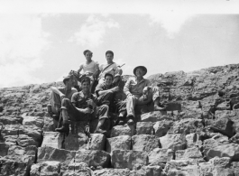 "Tony, Mac, Crider, Elles, Kirby, Joe, on dam at falls."  A dam and and falls about 8 miles southeast of the Luliang air base area in Yunnan province, China, where the GIs went to swim and relax. During WWII.