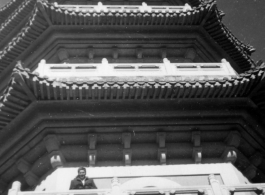 American woman on pagoda at Purple Mt. Park, Nanjing, China, late 1945.