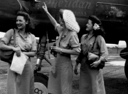 Celebrities visit and perform at Yangkai, Yunnan province, during WWII: Mary Landa, Ann Sheridan, Ruth Dennis pose with B-25 with Sheridan's image as nose art.