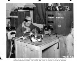S/Sgt. Ed Toy of Chicago, Illinois, repairs instruments of Curtiss P-40s at an aircraft factory somewhere in China during WWII.  The factory was fitted to rebuild P-40s for the American Volunteer Group (AVG) and the Chinese continued the same operations for the U.S. Air Force.  January 1, 1943.