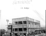 Allied communications HQ at Lashio, Burma, in 1945, with two technicians up on pole working on line from Ledo-Burma Road junction.  Photo from C. A. Brashear.