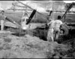 12th Air Service Group mechanics salvage a P-51 fighter in Guangxi, China, during WWII.