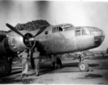 "Proud of Our Work On This Aircraft--Bukey and Miller pose for a photo in front of Casey Vincents B-25 The Silver Slipper at Kwelin [Guilin], China." Caption courtesy of Elmer Bukey.