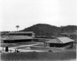 A set of buildings and covered walkway at an American base in China during WWII.