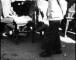 People busy on a street in China during WWII.