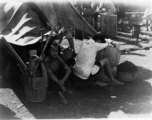 Exhausted and overheated Chinese refugees at the train station in Liuzhou during WWII, in the fall of 1944, as the Japanese advanced during the Ichigo campaign.