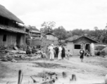 An American photographer visits a village near Yangkai, Yunnan province, China, during WWII.