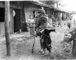 Local people in Yunnan province, China: Two of the village's destitute walking down the road.
