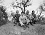 Yunnan (China), three young men employed as housekeepers and launderers sitting with Bert Krawczyk: "These are three houseboys from the airbase at Luliang. Houseboys were provided by the Chinese government under a reverse lend-lease program. The China War Area Service Command administered the program. This command was set up by Madame Chiang Kai-Shek to take care of the food and housing needs of American servicemen in China, who were considered guests by the Chinese government."