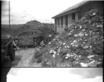 23rd Fighter Control Squadron buildings, surround by bomb barriers, at an American air base in WWII in Yunnan province, China, most likely around the Luliang air base area.