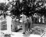 Solemn burial ceremony for American GIS who had died at a temporary war-time graveyard. In the CBI, during WWII.