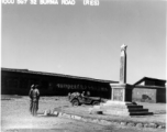 10CU 5G7 32 BURMA ROAD (RES). Monument.  This is a Chinese monument in memoriam for an American “Lieutenant,” but the name is not clear in the image. On the wall behind, among the Chinese slogans (about how being injured for the country is the greatest glory) is the slogan in English: "FIGHT FOR RIGHTEOUSNESS."
