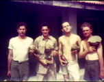 American flyers goof in front of barracks in China.