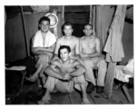 Engineers of the 797th Engineer Forestry Company pose in their barracks in Burma.  During WWII.