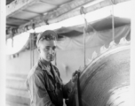 GI of the 797th Engineer Forestry Company in Burma, fixing saw blade in mill.  During WWII.