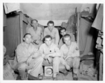 Engineers of the 797th Engineer Forestry Company pose in their barracks in Burma.  During WWII.