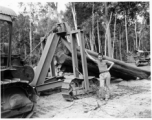 797th Engineer Forestry Company in Burma, loading logs for milling for bridge building along the Burma Road.  During WWII.