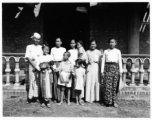 Local people in Burma near the 797th Engineer Forestry Company--Man, women, and children, and a happy puppy.  During WWII.