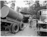 797th Engineer Forestry Company in Burma, GI fuels logging truck along the Burma Road.  During WWII.