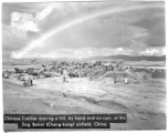 Workers removing hill by hand labor at Chenggong (Dog Baker) air base during WWII.