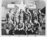 Crew of B-24 bomber of the 9th Bombardment Squadron, 7th Bombardment Group, 10th Air Force, pose with their B-24 bomber during WWII.  Back row L-R: S/Sgt. Martin H. McGuffin (Gunner), S/Sgt. Thomas Carroll (Gunner), S/Sgt. Leonard J. Lueken (Radar Operator), S/Sgt. Harry Russell (gunner), S/Sgt. Stanley Berman (Engineer), S/Sgt. Wayne Shirley (Gunner)  Front L-R: Lt. Virgil L. Poston (Pilot), 2nd Lt. Stanley Wasserman (Copilot), 2nd Lt. Walter L. Wegner (Navigator), 2nd Lt. Thurzal Q. Terry (Bombardier)