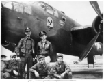 Flyers with B-25 Mitchell bomber.  Rear: Wendell Hanson, J. Percival.  Front: Unknown, Frank McKenna (center), and Sgt. Douglas Bell (right).  22nd Bombardment Squadron, in the CBI.