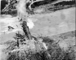 Aerial view of a railroad bridge just blown up by 22nd Bombardment Squadron in the CBI.