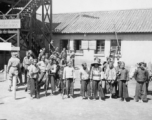 A Chinese and American search party being organized to find an American pilot whose plane had gone down in a location pinpointed by the 23rd Fighter Control Squadron, which was one of its duties.  The sign on the stairway in the background reads "Air Transport Command Operations."  From the collection of David Axelrod.