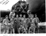 Engine change crew work on a C-47 transport plane in the CBI. 330th Troop Carrier, 9th CC. 1945.  Sergeant Arnold Wall in far back against the fuselage. 
