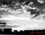 Tents for GIs at the American base at Liuzhou during WWII, silhouetted against the sunset.