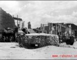 A GI inspects a bunker near Liuzhou in WWII, in 1945.