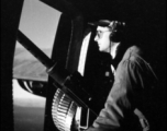 A gunner keeps lonely vigil at the waist gun on a B-24.  From the collection of Hal Geer.