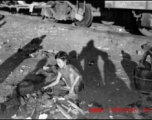 Chinese refugee--a young girl in this case--tends a cooking fire to boil water next to the train tracks in Liuzhou during WWII, in the fall of 1944, as the Japanese advanced during the Ichigo campaign.