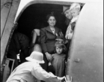 A civilian family of westerners on a military C-47 transport in the CBI during WWII, on June 8, 1944.