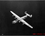 The B-24 bomber "80 Days" in flight.