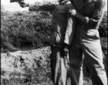 Robert Zolbe teaches the barracks houseboy how to shoot a pistol. In China during WWII.