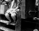 Enroute with Kweilin evacuation party.  Small Chinese evacuee hitches a ride on our train stops.  She carries all her meager possessions, bound for she knows not where, hopeful only for safety.  Pre-focused grab shot.  All Chinese females intensely dislike cameras. They are unusually shy, especially evacuees.