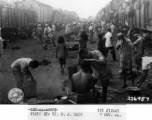 October 7, 1944  Congestion and lack of sanitation shown in crowded station at Liuchow (Liuzhou), Kwangsi (Guangxi) as refugees wait movement westward during WWII.   Photo: Lt. N. J. Dain, Liuzhou, China.
